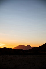 bright sunset over red desert of Namibia