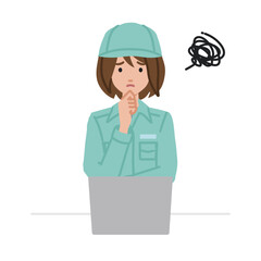 デスクで座ってPCを開いて困っている作業員の女性