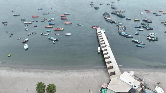 Paracas Port in Peru with the boats and city.