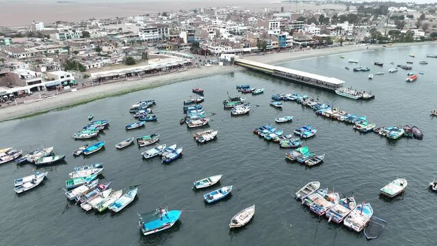 Paracas Port in Peru with the boats and city.