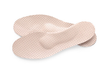 Beige orthopedic insoles isolated on white, top view