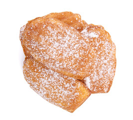 Delicious madeleine cakes with powdered sugar on white background, top view