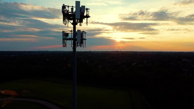 Circling around cell phone tower during dramatic sunrise