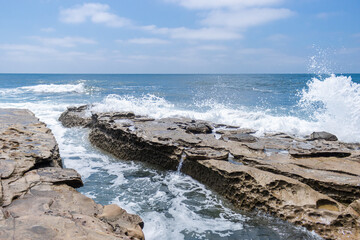 Waves crashing on rocks