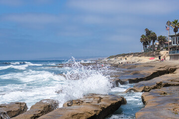 Waves on beach rocks
