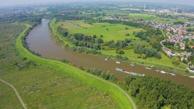 Drone navigating over a landscape with a barge in its view