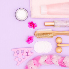 Obraz na płótnie Canvas Beauty and cosmetics products on pastel purple background. Spa concept flat lay