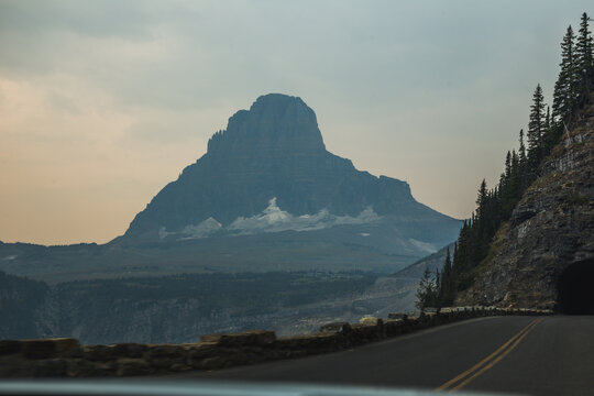 Stratified mountain with road tunnel