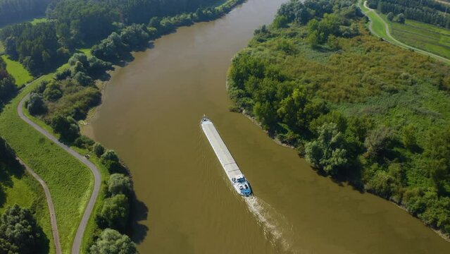 Drone flying over a barge ship on the Schelde in Belgium
