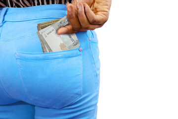 Black lady putting few Syrian pound notes into her back pocket. Removing money from pocket, hold money