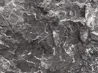 Natural gray stone background. Structure with white veins