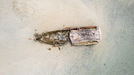 A wreck ship is seen on the shore of a beach in Koh Samui, Thailand