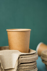 Eco friendly,take away disposable cup kraft paper and tray on green background.food packaging