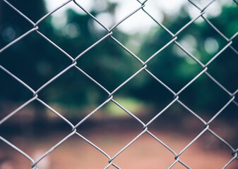 Chain link fence with blurred background : demarcation concept