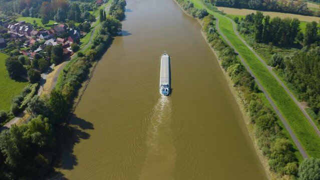 Drone flying over a barge ship on the Schelde in Belgium
