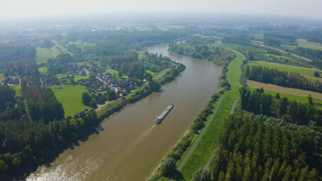 Drone flying over a barge ship on the Schelde in Belgium