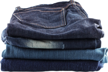 Many jeans stacked isolated  on a white background