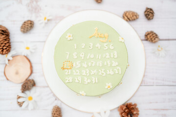 green tea cake with calendar marked with date on August