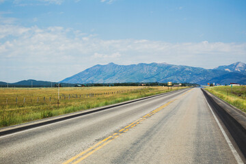 Road view of farmland and mountains