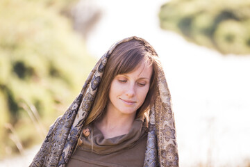 Woman with scarf draped over head