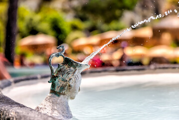 Fountains and pathways in the hot springs on the island of Ischia in Italy
