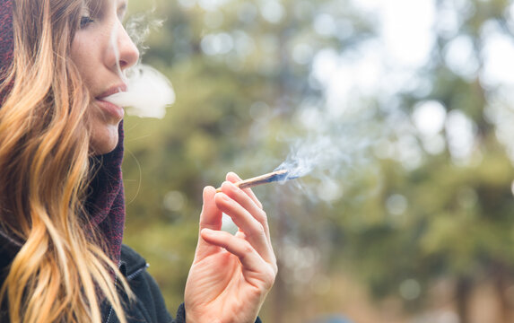 Woman smoking cannabis joint