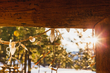 Christmas lights hang from log beams