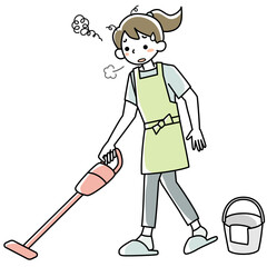 疲れた表情で掃除機をかける若い女性
