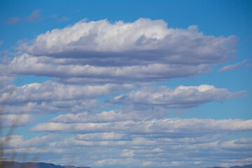 Layered clouds in blue sky