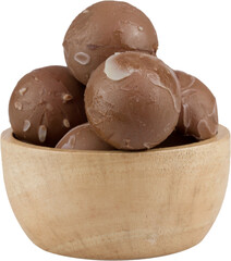 chocolate balls in wooden cup.