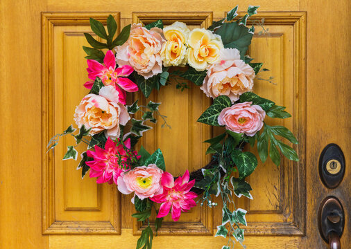 Floral wreath on wooden door