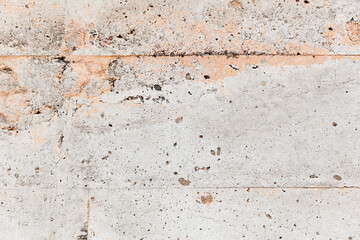 Grunge texture: Gray cement wall with peach colored paint and bubble texture