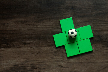 classic football on green wood , soccer manager tactics concept