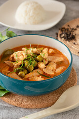 Thai red curry soup with chicken, served with streamed jasmine rice, Thai tradition food 