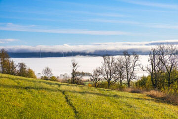 Grass meadow and with mist in the valley