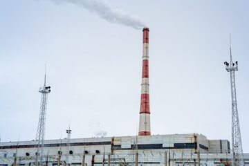 Gas combined heat and power plant with pipes, smoke, steam, power stations.