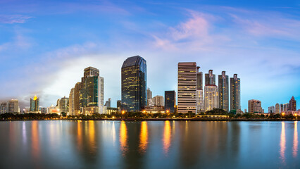 Fototapeta na wymiar Bangkok Cityscape, Business district with Park in the City at dusk (Thailand)