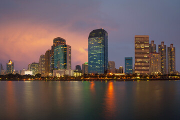 Bangkok Cityscape with building in an economic business district from Benjakitti park at dusk. (Thailand)