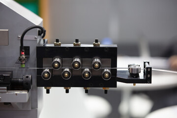 Spring forming machine for industry. Proximity Sensor, use for metal detection, installed in feeder...