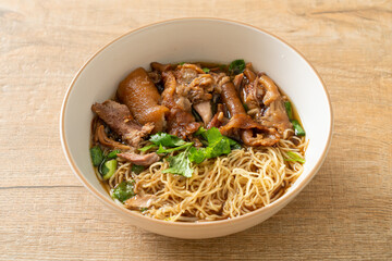 Stewed pork leg noodles in brown soup