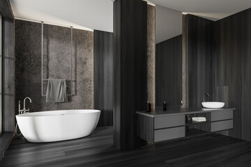 Fototapeta na wymiar Dark bathroom interior with sink with mirror and bathtub, accessories