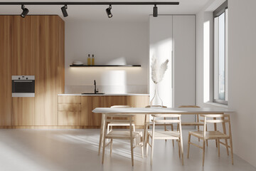 Front view on bright kitchen room interior with dining table
