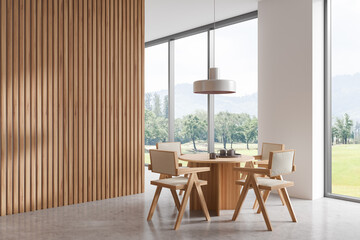 Light living room interior with table and chairs, panoramic window. Empty wall