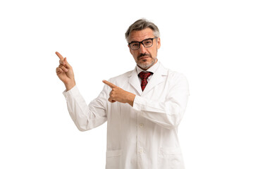 Portrait of senior doctor pointing up showing on copy space looking at camera. isolated on white background