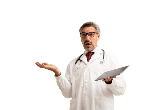 Portrait Of Confuse Doctor In Doctor Coat Wearing Stethoscope And Eye Glasses, Using Digital Tablet. Isolated On White Background.