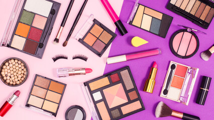 Make up products pattern on pink and purple background. Flat lay