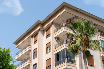 Fototapeta na wymiar Modern luxury residential apartment. Residential building with blue sky.