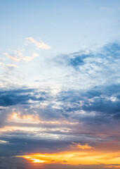 dark blue clouds on the sunset sky with and rays of the setting sun selective focus,