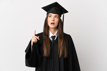 Teenager Brazilian university graduate over isolated white background thinking an idea pointing the finger up