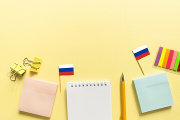 Back to school background. School accessories on a yellow background.